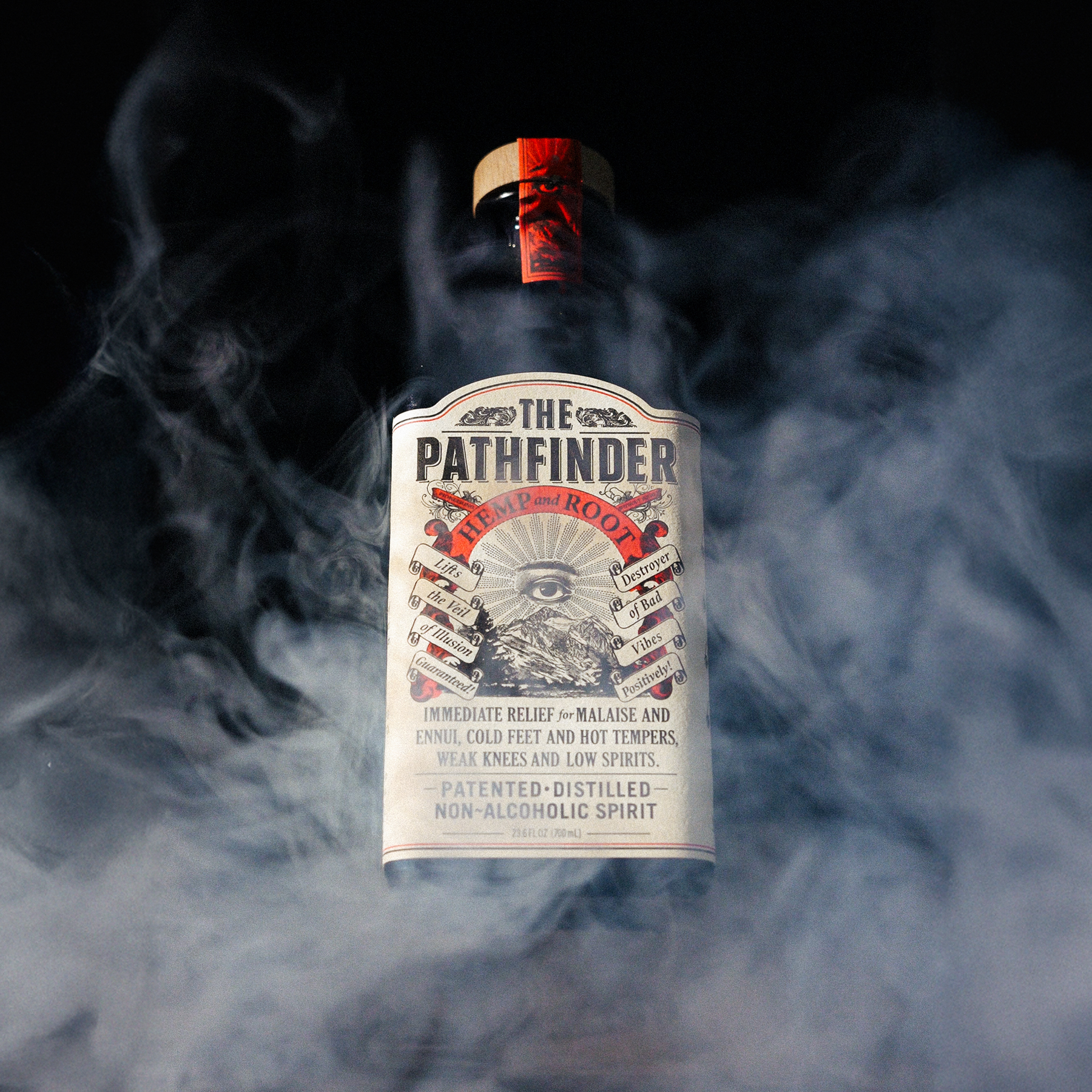 The Pathfinder Hemp and Root non-alcoholic spirit bottle surrounded by swirling smoke on a dark background.